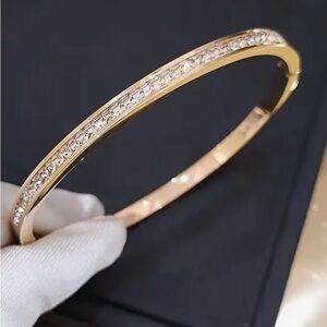 Elegant Gold Stainless Steel Bangle with Crystal Accents